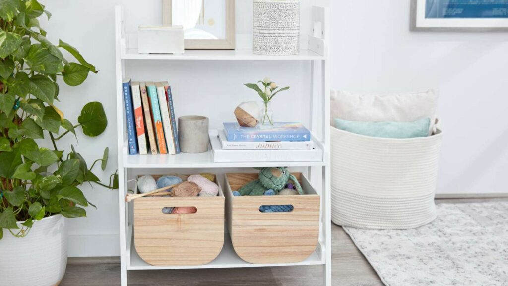 A Shelf with Books ,Wool and Teddy Bears