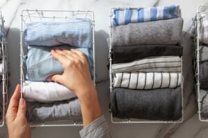 A woman organising clothes